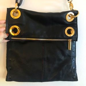 Black Leather over the shoulder purse with gold rings by Hammitt red interior